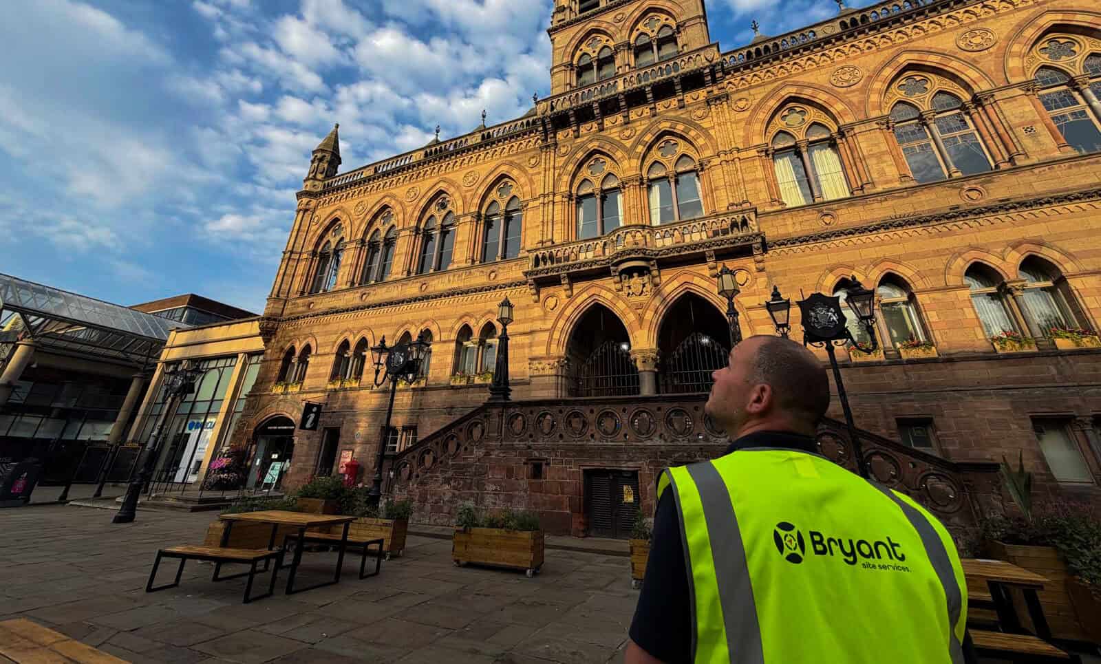 Bryant Site Services technician inspecting historic building exterior.
