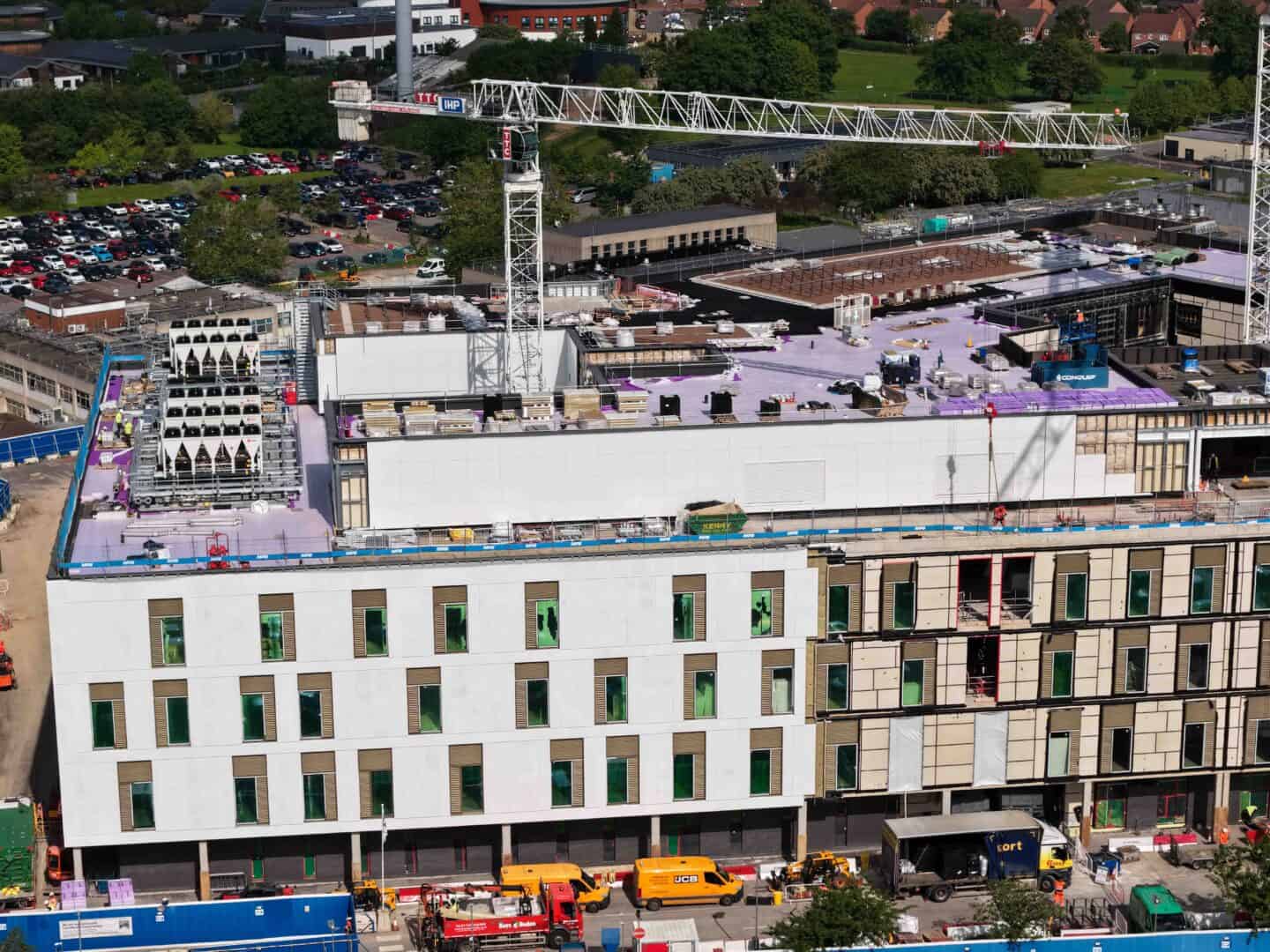 Construction site at Royal Shrewsbury Hospital with cranes and building materials.