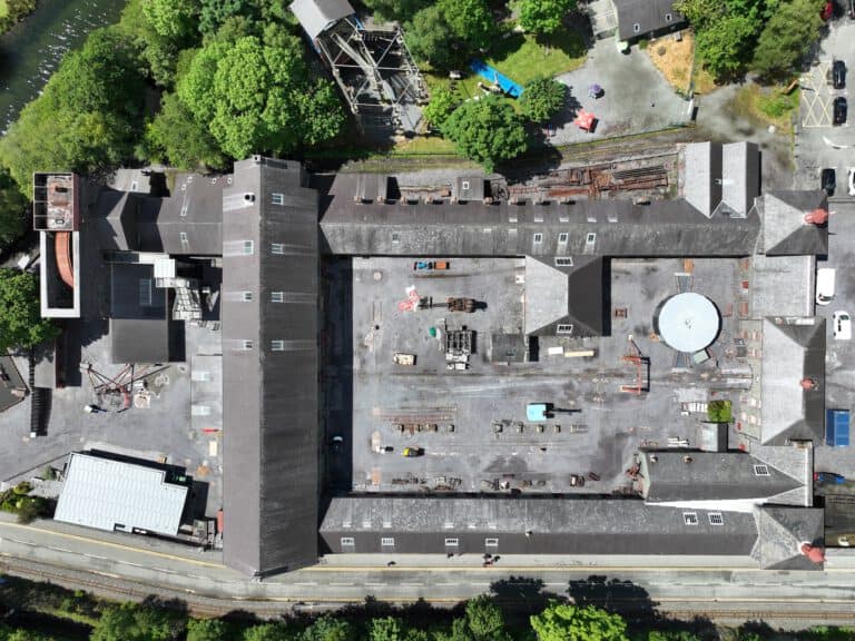 Aerial inspection of Bryant Site Services building and surrounding area.