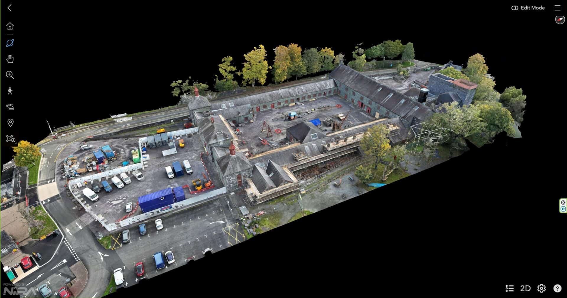 Aerial view of the historic National Slate Museum with surrounding trees and parking area.