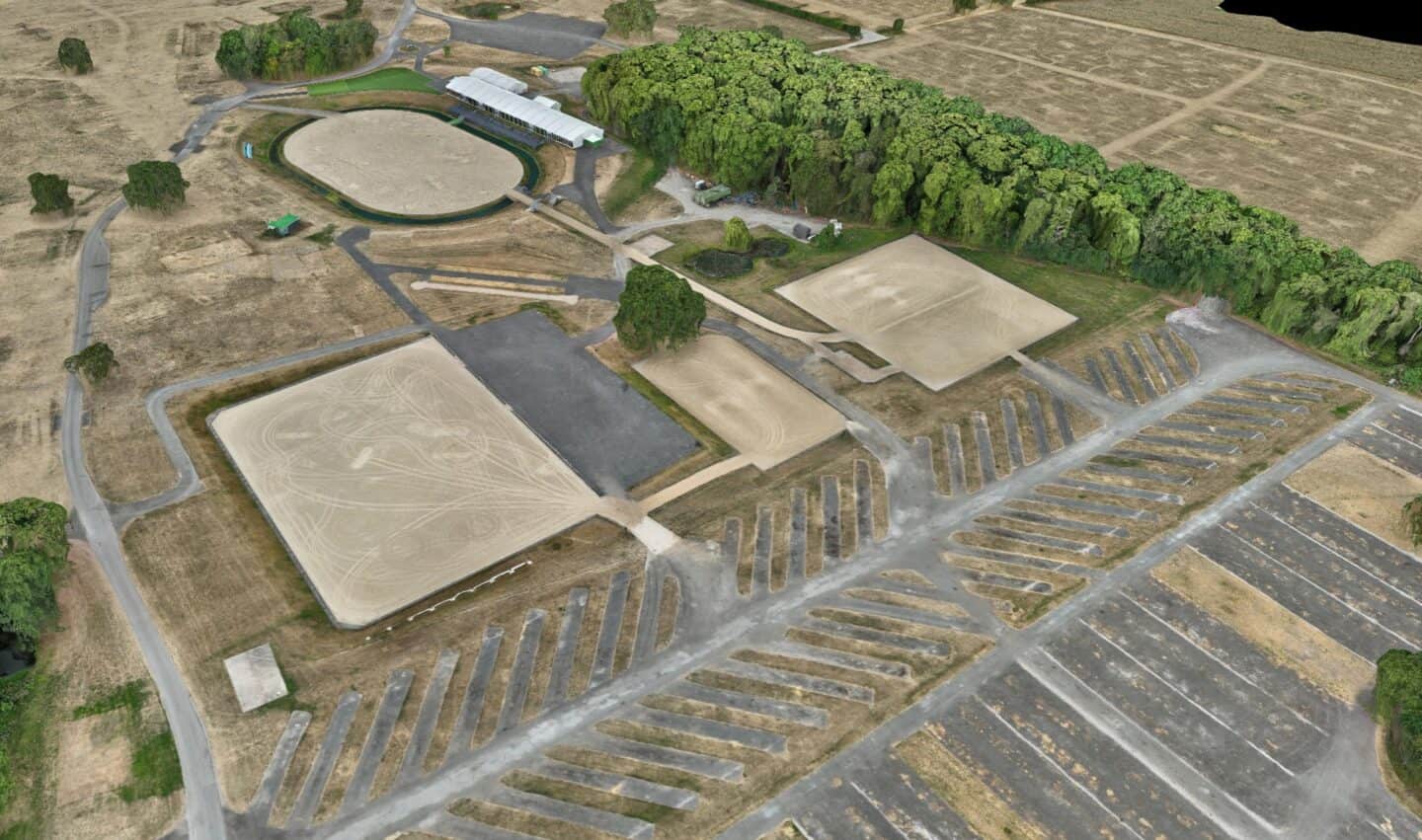 Construction site with water drainage and earthworks in progress.