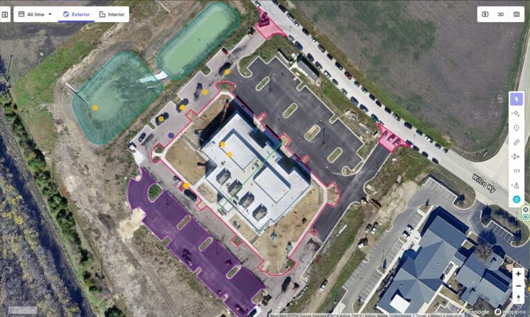 Aerial view of Bryant Site Services office and parking lot with surrounding landscape.